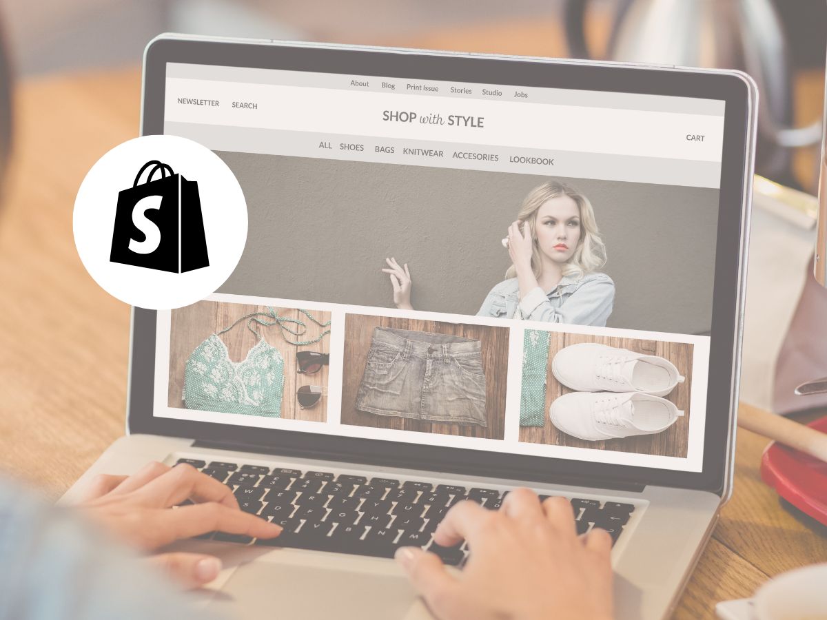 A demo Shopify website theme on a laptop. eCommerce design for small business owners.