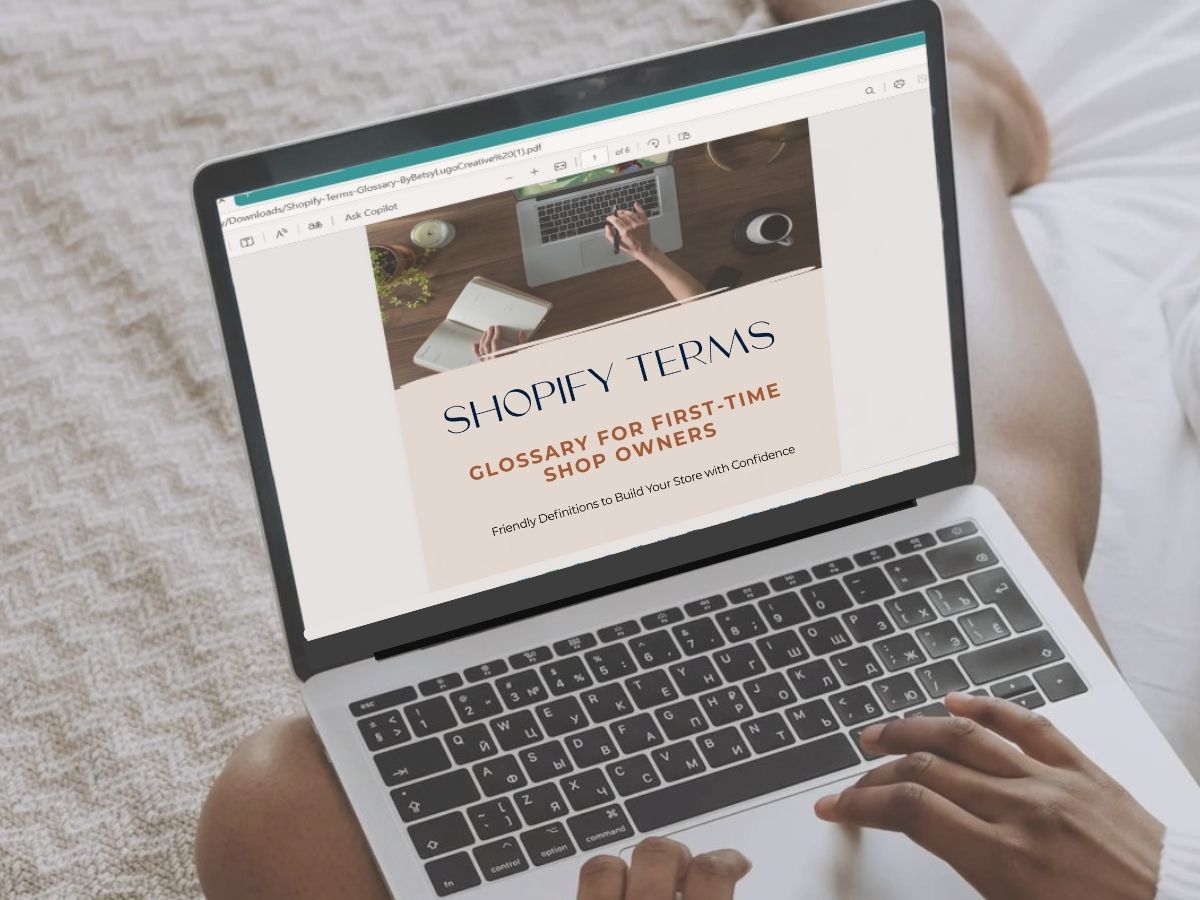 Shopify terms for beginner shop owners on a laptop