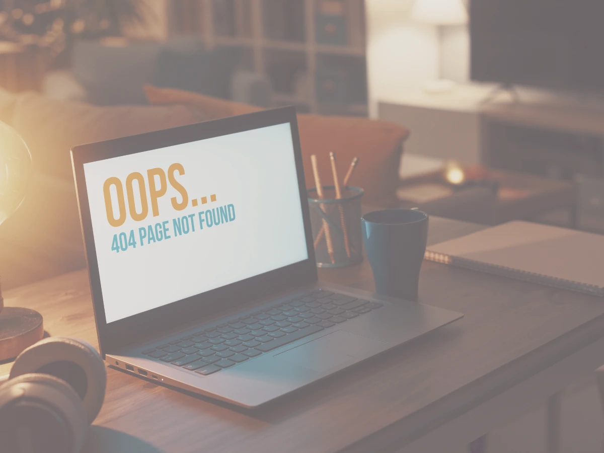 OOPS...404 Page Not found screen displayed on a laptop.